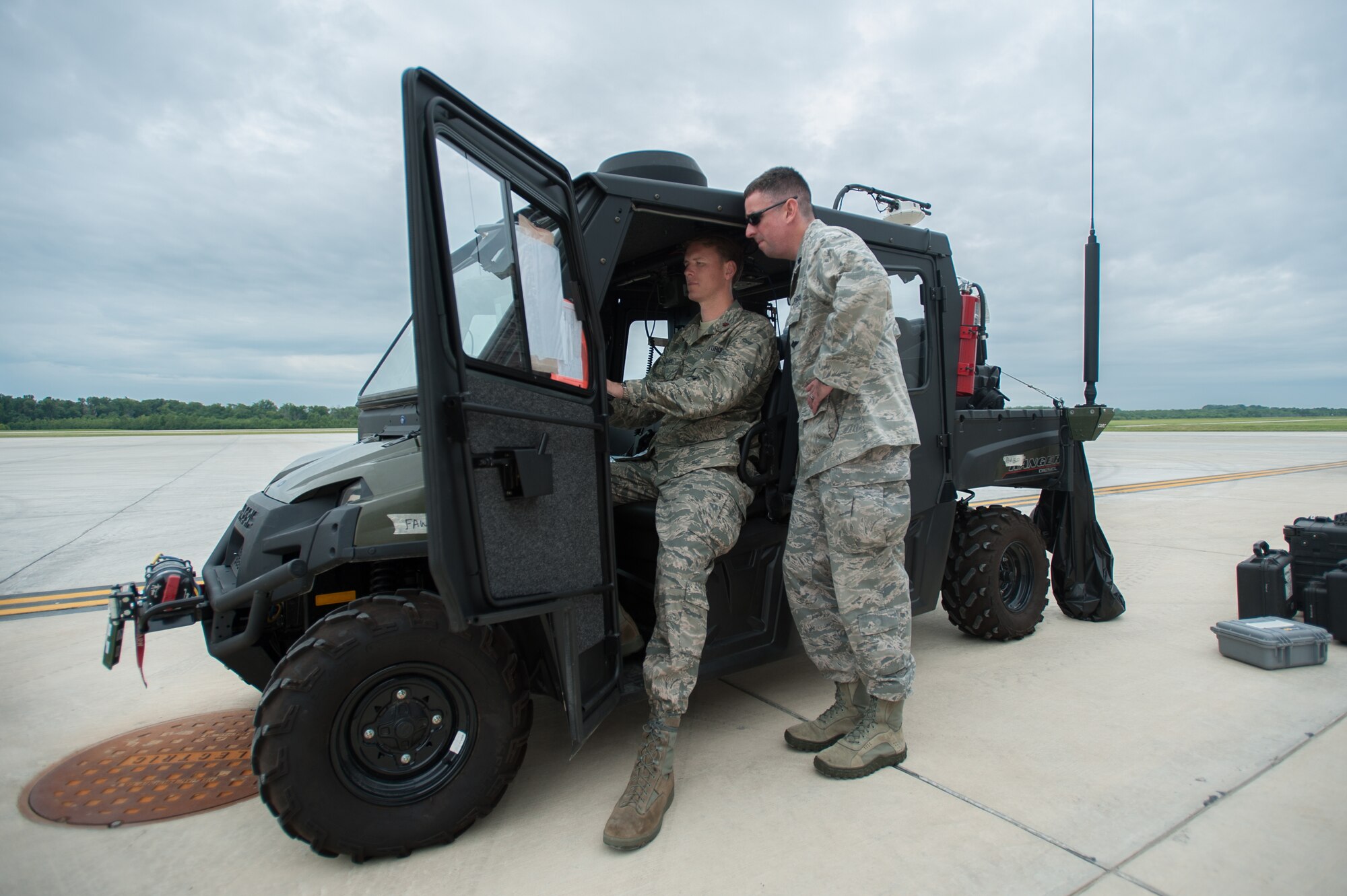 Maj. Ryan Adams (left), airflow operations officer for the Kentucky Air National Guard’s 123rd Contingency Response Group, and Lt. Col. Bruce Bancroft, 123rd operations officer, monitor scheduled airlift missions from a mobile command post at MidAmerica St. Louis Airport in Mascoutah, Ill., on Aug. 5, 2013, as part of Exercise Gateway Relief, a U.S. Transportation Command-directed earthquake-response scenario. The 123rd is joining forces with the U.S. Army’s active-duty 689th Rapid Port Opening Element from Fort Eustis, Va., to stand up and operate a Joint Task Force-Port Opening, which combines an Air Force Aerial Port of Debarkation with an Army trucking and distribution unit. The aerial port ensures the smooth flow of cargo and relief supplies into affected areas by airlift, while the trucking unit facilitates their final distribution over land. (U.S. Air National Guard photo by Maj. Dale Greer)