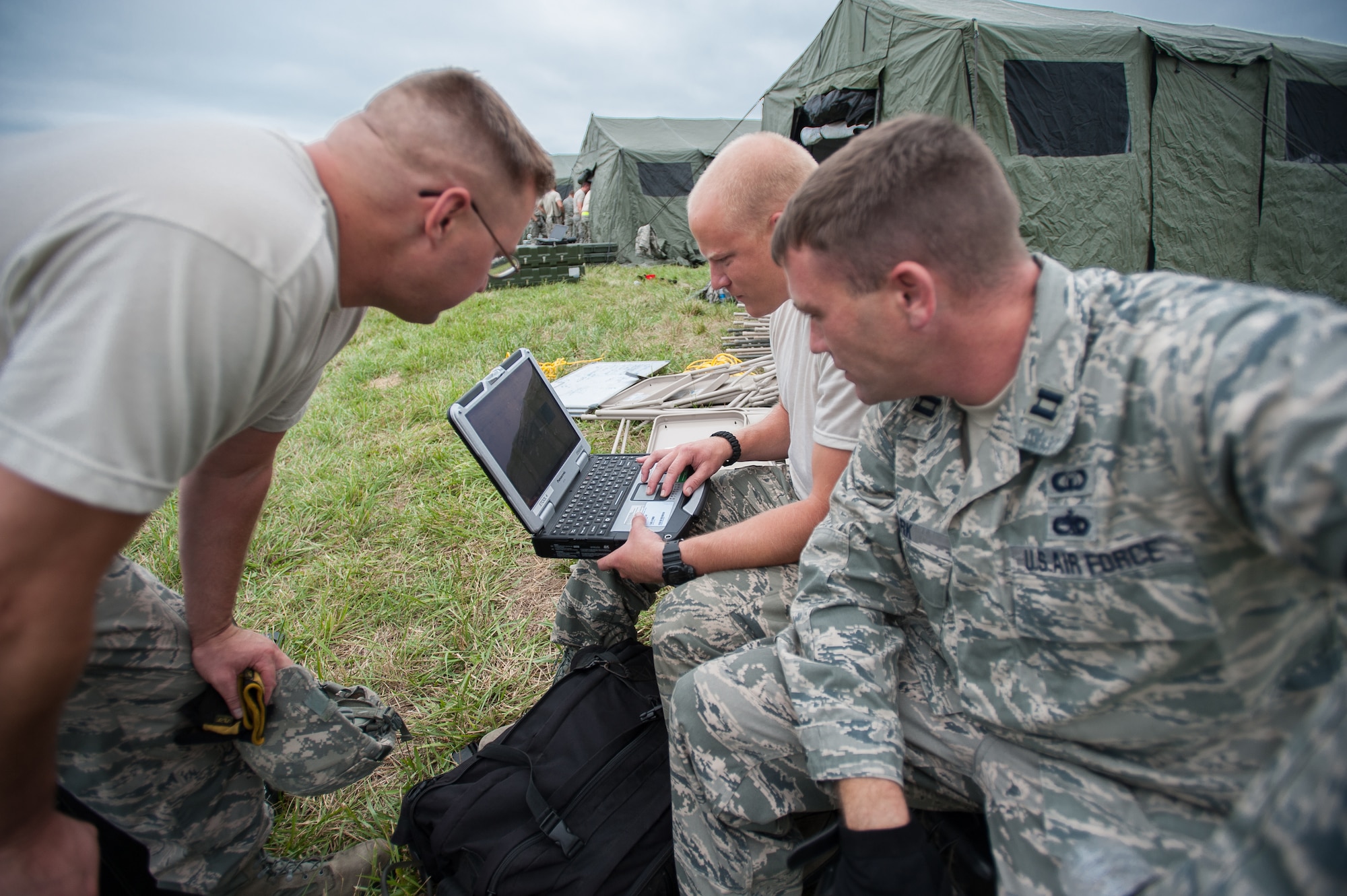 Airmen from the Kentucky Air National Guard’s 123rd Contingency Response Group create an aircraft parking plan at MidAmerica St. Louis Airport in Mascoutah, Ill., on Aug. 5, 2013, as part of Exercise Gateway Relief, a U.S. Transportation Command-directed earthquake-response scenario. The 123rd is joining forces with the U.S. Army’s active-duty 689th Rapid Port Opening Element from Fort Eustis, Va., to stand up and operate a Joint Task Force-Port Opening, which combines an Air Force Aerial Port of Debarkation with an Army trucking and distribution unit. The aerial port ensures the smooth flow of cargo and relief supplies into affected areas by airlift, while the trucking unit facilitates their final distribution over land. (U.S. Air National Guard photo by Maj. Dale Greer)