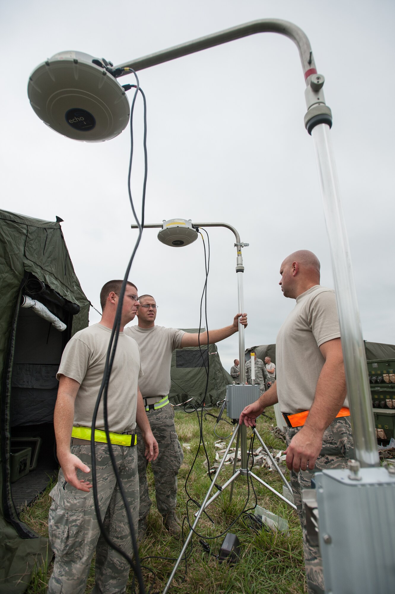 Airmen from the Kentucky Air National Guard’s 123rd Contingency Response Group assemble Radio Frequency Identification gear, used to wirelessly track cargo and equipment, at MidAmerica St. Louis Airport in Mascoutah, Ill., on Aug. 5, 2013, as part of Exercise Gateway Relief, a U.S. Transportation Command-directed earthquake-response scenario. The 123rd is joining forces with the U.S. Army’s active-duty 689th Rapid Port Opening Element from Fort Eustis, Va., to stand up and operate a Joint Task Force-Port Opening, which combines an Air Force Aerial Port of Debarkation with an Army trucking and distribution unit. The aerial port ensures the smooth flow of cargo and relief supplies into affected areas by airlift, while the trucking unit facilitates their final distribution over land. (U.S. Air National Guard photo by Maj. Dale Greer)