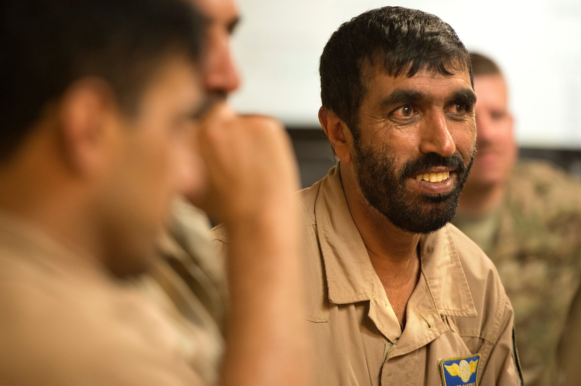 Afghan Air Force Lt. Col. Haji Baktullah, Kabul Air Wing Rotary Wing Squadron commander and Mi-17 pilot, talks through details of Operation Seemorgh with U.S. air advisors July 22, 2013 at Jalalabad Airfield, Afghanistan. Operation Seemorgh, named after a mythical bird, is the largest Afghan-led combat operation in more than 30 years, combining air and ground forces in an offensive focused on Taliban in Loghar Province. (U.S. Air Force Photo/Master Sgt. Ben Bloker)