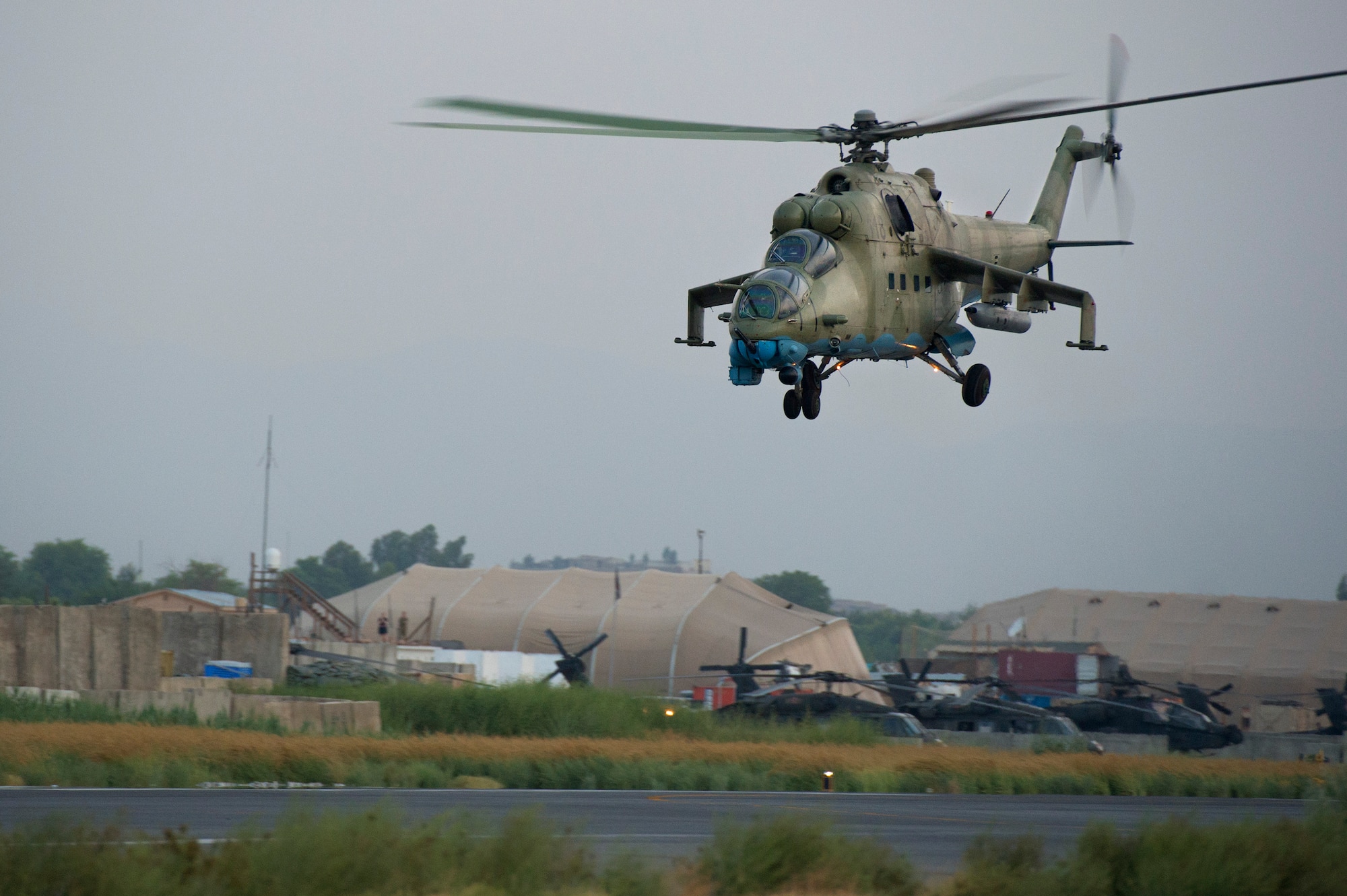 An Afghan Air Force Mi-35 helicopter departs for Loghar Province in the early morning hours of July 23, 2013, on the first day of Operation Seemorgh at Jalalabad Airfield, Afghanistan. Operation Seemorgh, named after a mythical bird, is the largest Afghan-led combat operation in more than 30 years, combining air and ground forces in an offensive focused on Taliban in Loghar Province. (U.S. Air Force Photo/Master Sgt. Ben Bloker)