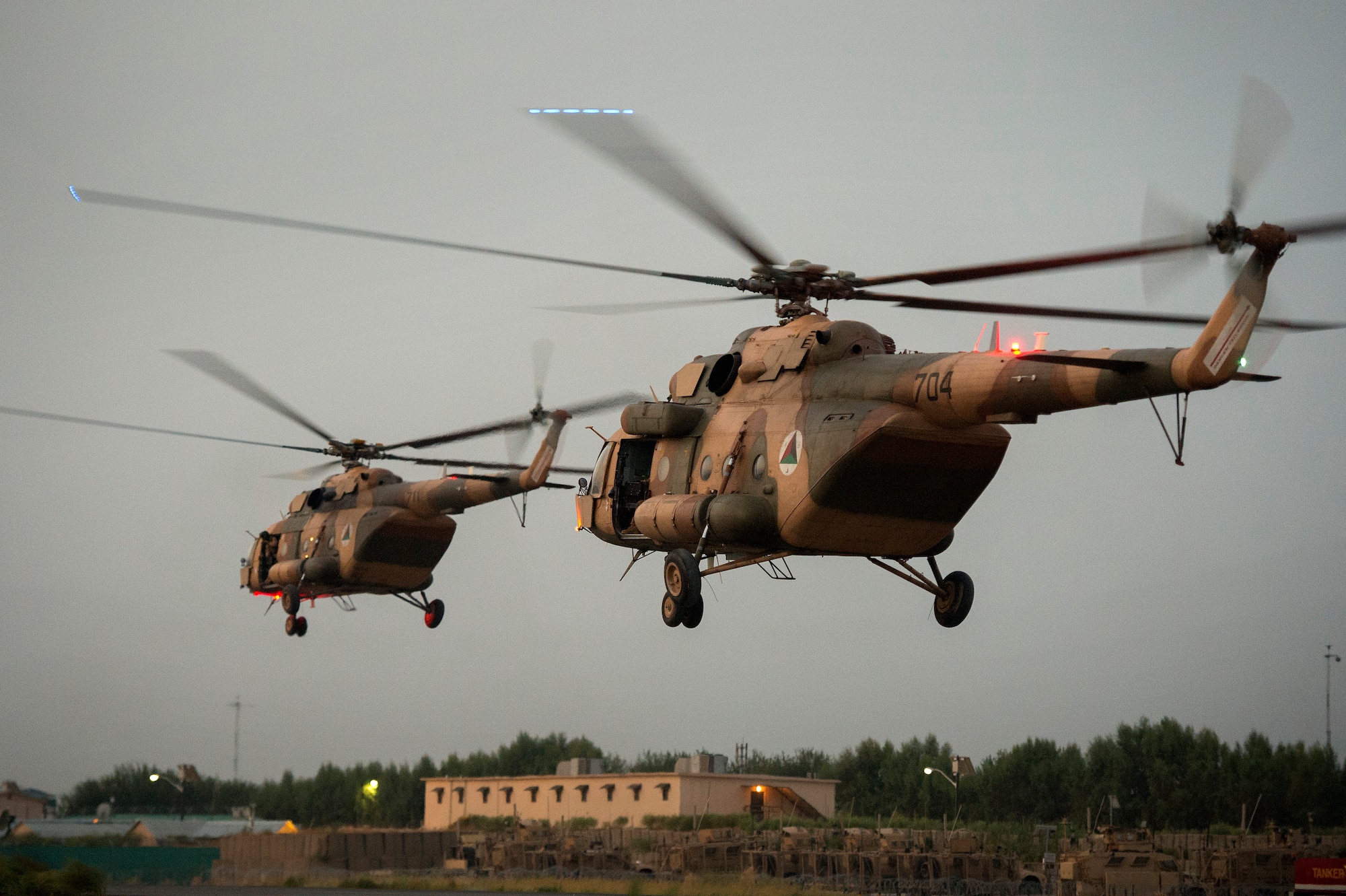 A pair of Afghan Air Force Mi-17 helicopters depart for Loghar Province in the early morning hours of July 23, 2013, on the first day of Operation Seemorgh at Jalalabad Airfield, Afghanistan. Operation Seemorgh, named after a mythical bird, is the largest Afghan-led combat operation in more than 30 years, combining air and ground forces in an offensive focused on Taliban in Loghar Province. (U.S. Air Force Photo/Master Sgt. Ben Bloker)