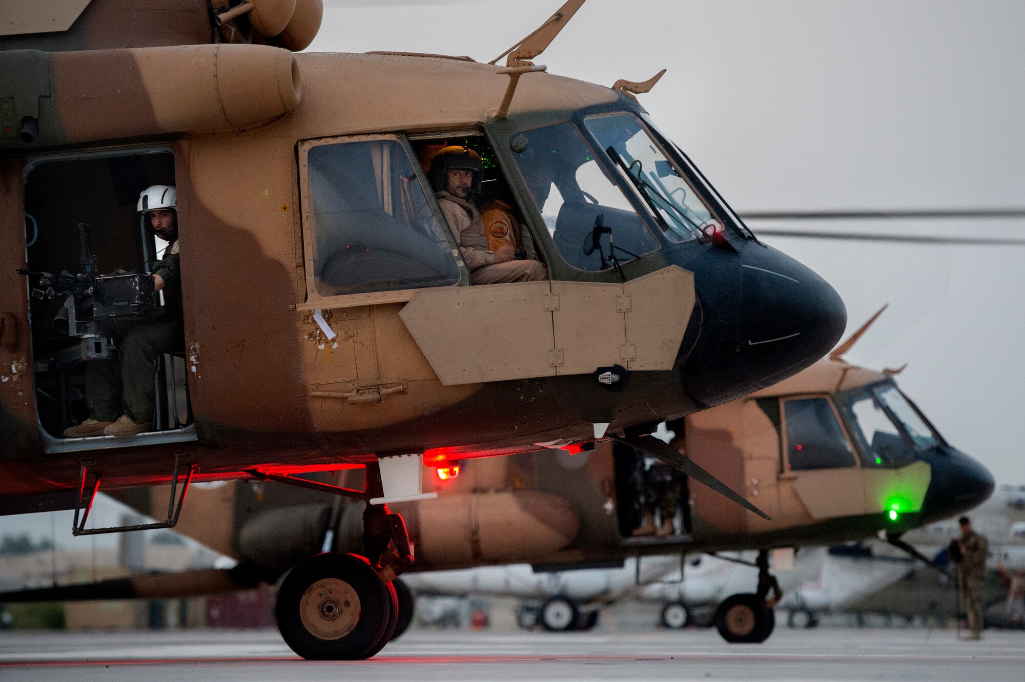 An Afghan Air Force Mi-17 helicopter crew waits for the go-ahead to launch on the early morning hours of July 23, 2013, on the first day of Operation Seemorgh at Jalalabad Airfield, Afghanistan. Operation Seemorgh, named after a mythical bird, is the largest Afghan-led combat operation in more than 30 years, combining air and ground forces in an offensive focused on Taliban in Loghar Province. (U.S. Air Force Photo/Master Sgt. Ben Bloker)