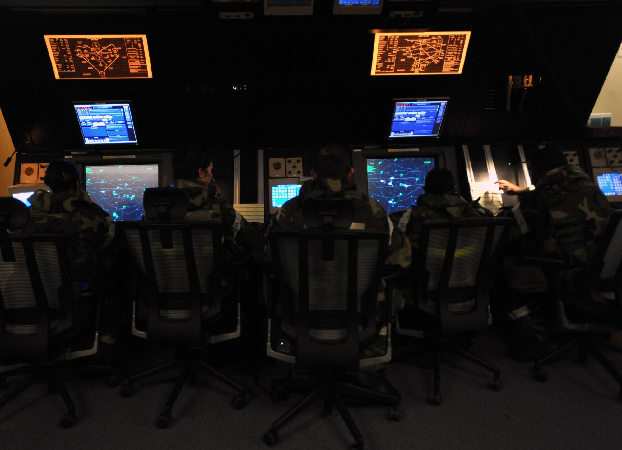 Radar approach controllers from the 51st Operations Support Squadron monitor air traffic at Osan Air Base, Republic of Korea, during Operational Readiness Exercise Beverly Midnight 13-03 August 7, 2013. Osan provides combat ready forces for close air support, air strike control, forward air control-airborne, combat search and rescue, counter air and fire, and interdiction in the defense of the ROK. (U.S. Air Force photo/Senior Airman Siuta B. Ika)