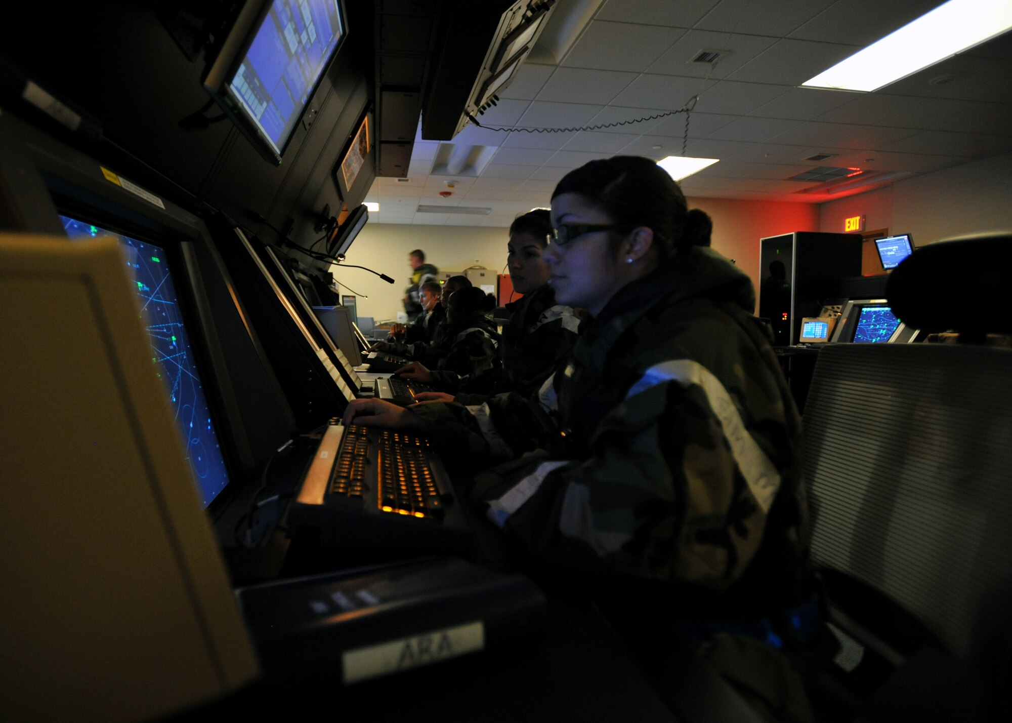 Radar approach controllers from the 51st Operations Support Squadron monitor air traffic during Operational Readiness Exercise Beverly Midnight 13-03 at Osan Air Base, Republic of Korea, August 7, 2013. Osan is in the fourth simulated wartime contingency exercise executed in 2013 that tests the base's ability to defend and execute the mission in a heightened state of readiness. (U.S. Air Force photo/Senior Airman Siuta B. Ika)