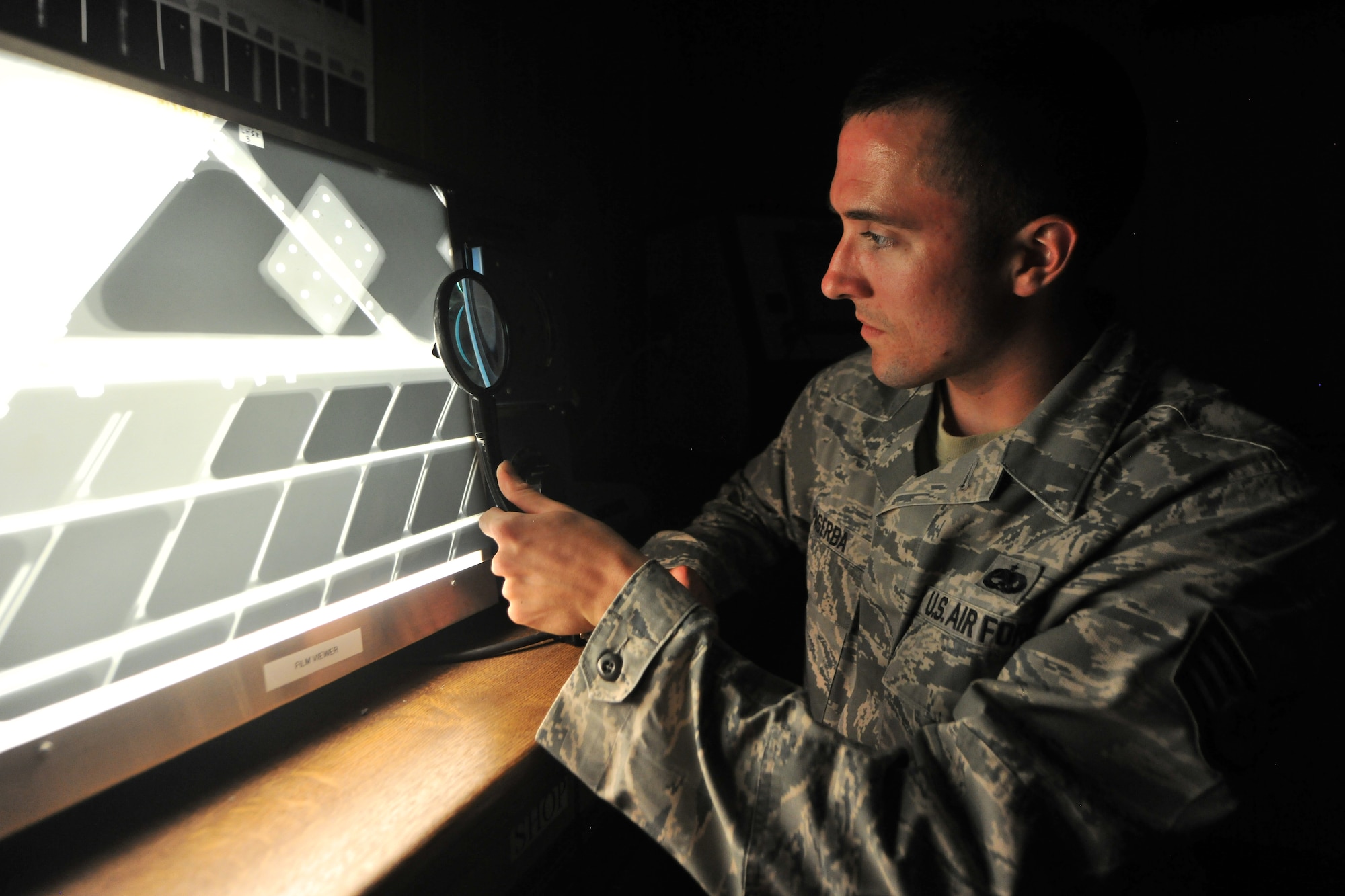 Staff Sgt. Joshua Paserba, 86th Maintenance Squadron nondestructive inspection technician, views a radiographic image of an aircraft’s internal structure, July 31, 2013, Ramstein Air Base, Germany.  Much like a medical x-ray examining bone fractures, NDI x-rays aircraft structures to pinpoint cracks in critical structures. (U.S. Air Force photo/Senior Airman Chris Willis)