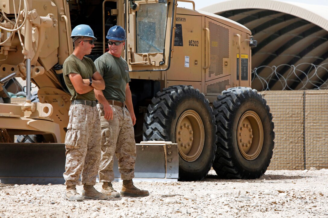 U.S. Marine Corps Lance Cpl. John M. Finegan, left, and U.S. Marine Corps Cpl. Wesley F. Kelly