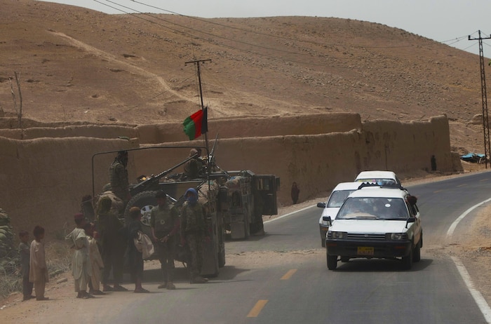 Afghan National Security Forces maintain security along a route used during a combat logistics patrol conducted by soldiers with the Army’s 1st Battalion, 26th Infantry Regiment, in Helmand province, Afghanistan, Aug. 4, 2013. The convoy helped provide security for a Marine Corps Community Services Marine with Combat Logistics Regiment 2, Regional Command (Southwest), as he provided commodity sales to isolated servicemembers. 