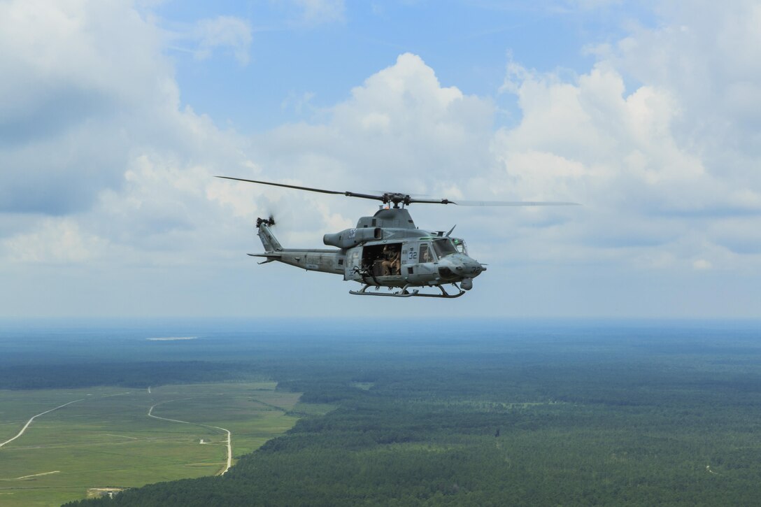 A Marine Medium Tiltrotor Squadron (VMM) 263 (Reinforced), 22nd Marine Expeditionary Unit (MEU) UH-1Y Huey returns to Marine Corps Air Station New River, N.C., after working with 1st Battalion, 6th Marine Regiment scout snipers during a Special Operations Training Group urban sniper course, July 30, 2013. The MEU is scheduled to deploy in early 2014 to the U.S. 5th and 6th Fleet areas of responsibility with the Bataan Amphibious Ready Group as a sea-based, expeditionary crisis response force capable of conducting amphibious missions across the full range of military operations. (U.S. Marine Corps photo by Cpl. Manuel A. Estrada/Released)