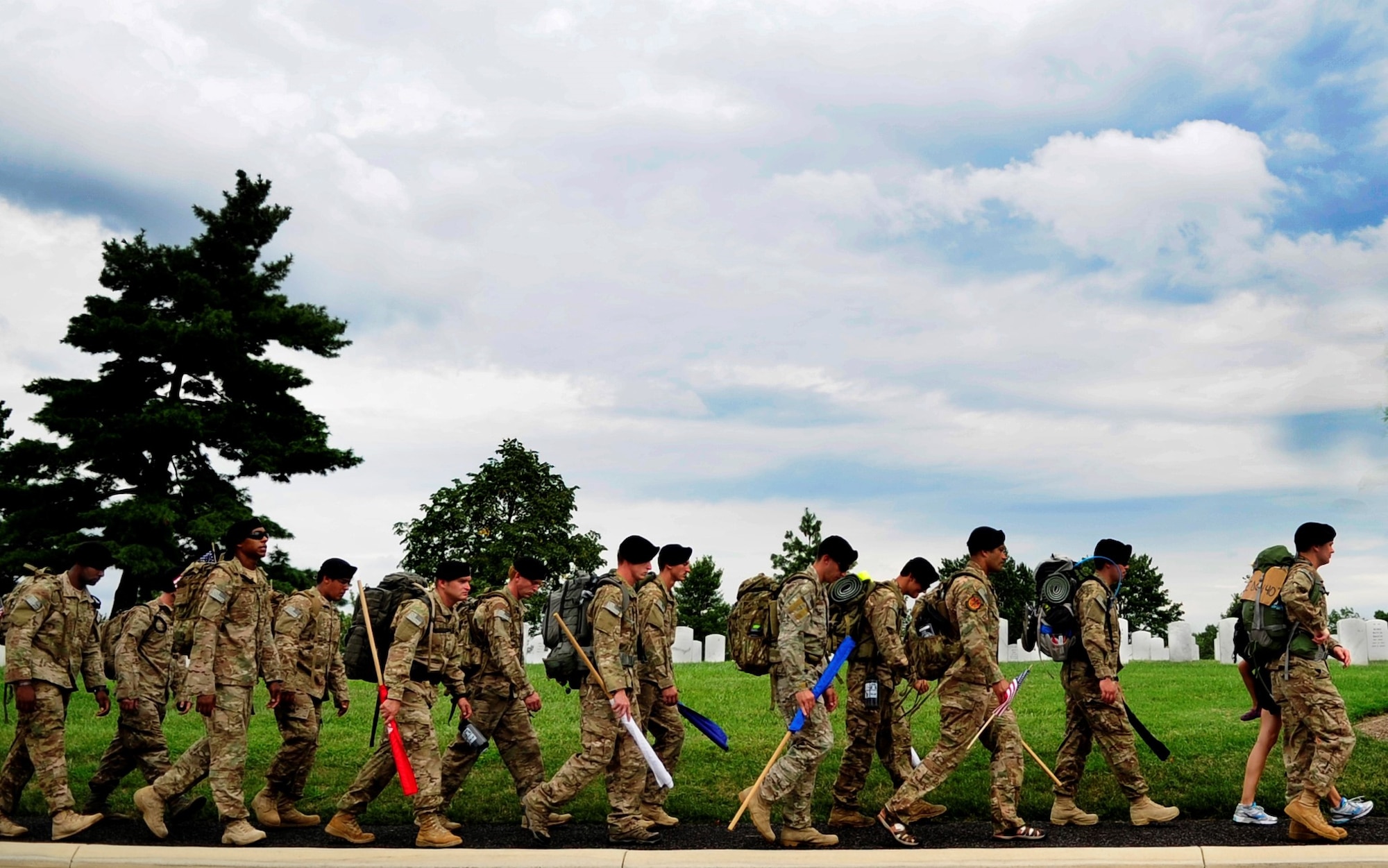 Tactical Air Control Party Airmen from the 13th Air Support Operations Squadron, Ft. Carson, Co. ruck through Arlington National Cemetery during the final leg of their 140-mile ruck to honor their fallen commander, Maj. David Gray, who was killed in Afghanistan last year, Aug. 7, 2013. The Airmen are marching from Dover Air Force Base, Del., the receiving point for deceased service members killed in war, to Arlington National Cemetery, to Gray’s gravesite. (U.S. Air Force photo/Senior Airman Lauren Main)