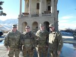 Col. George Conwill, Sgt. Stephen Conwill, 1st. Lt. Andrew Tillman and Lt. Col. James Tillman meet up and pose for a photo near their camp in Kabul, Afghanistan. The four soldiers are members of the 136th Maneuver Enhancement Brigade, Texas National Guard, and deployed together last fall for nine months.