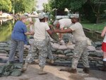 Missouri National Guard members, shown in 2008 sandbagging along the Mississippi River in Clarksville, Mo., more recently helped clear backlogged assistance cases.