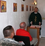 Brig. Gen. Patrick Dolan, a member of the Kentucky National Guard, conducts a Catholic mass for Soldiers in Djibouti, Africa.