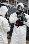 Georgia National Guard members suited up to approach the radiological source and enter the building during a recent drill.