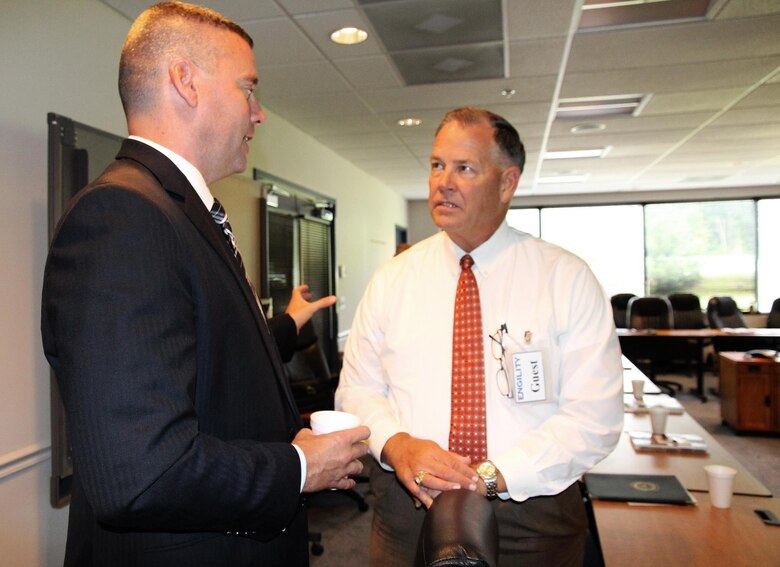 Michael Halloran, director of Science and Technology at Program Executive Officer Land Systems, speaks to Greg Jones, chief executive officer of Echelon Strategies, during the quarterly Industry Interface Council meeting Aug. 6 in Dumfries, Va. Marine Corps Systems Command hosted the event to discuss ways to improve communication between the command, PEO LS and industry partners.