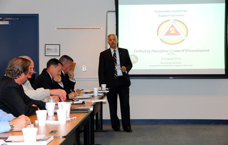 Paul Ortiz, director of Marine Corps Systems Command’s Acquisition Center for Support Services, speaks to industry attendees during the quarterly Industry Interface Council meeting Aug. 6 in Dumfries, Va. Marine Corps Systems Command hosted the event to discuss ways to improve communication between the command, PEO LS and industry partners. 