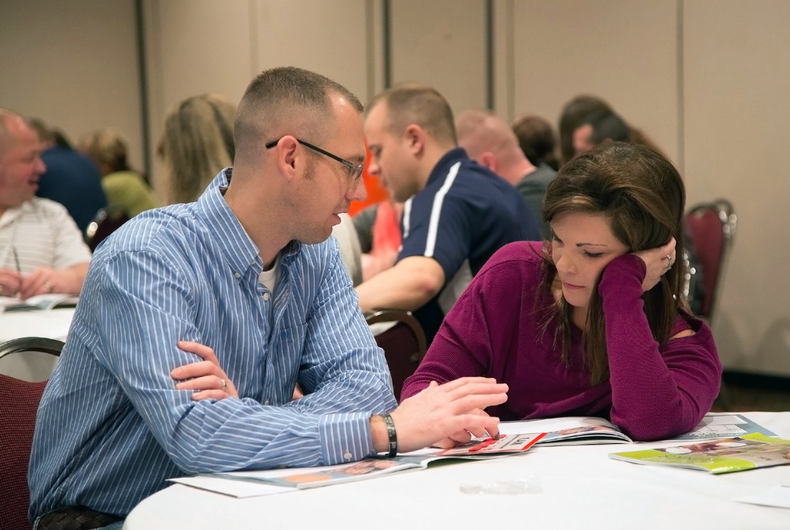 Sgt. Matt Phillippe participates in a discussion with his wife, Samantha Phillippe, during a Strong Bonds retreat Feb. 9. The two-day event focused on relationship education.
