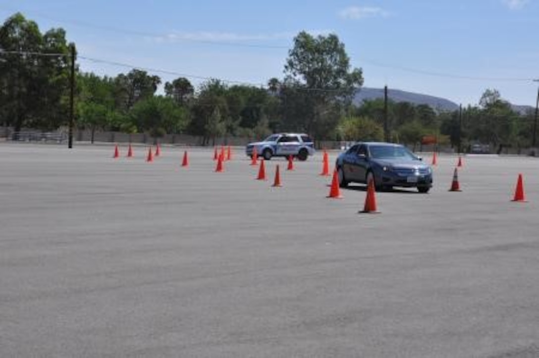 Marine Corps Logistics Base Barstow Police Department maneuvers through a simulated track during the semi-annual defensive driving course, July 31.