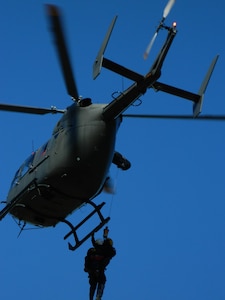 North Carolina Helicopter Aquatic Rescue Team (NCHART) crew are hoisted aboard a North Carolina National Guard UH-72 Lakota helicopter at Camp Butner National Guard Training Site Feb. 20, 2013.