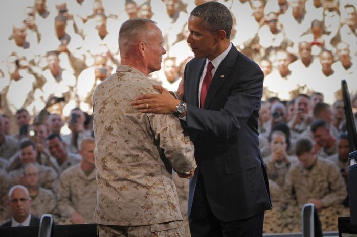 Major Gen. Lawrence D. Nicholson, the commanding general of 1st Marine Division, introduces President Barrack Obama to a crowd of Marines, sailors and family members at the air station aboard Camp Pendleton, Aug. 7, 2013. President Obama visited the base to thank the service members for their commitment to the mission in Iraq and Afghanistan, and to deliver encouragement to the future of the Marine Corps.