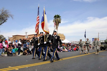 Staff Sgt. Pedro Villareal (2nd from left), along with the color guard detail from 3rd Battalion, 141st Infantry Regiment, Texas Army National Guard, participate at the 2013 George Washington Birthday Celebration Parade in Laredo, Texas, Feb. 23, 2013.