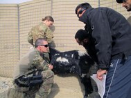 Capt. Chase Kohne of Kentucky's Agribusiness Development Team 5 speaks with local herders about how to care for their animals in Kandahar Province, Afghanistan, January 2013.