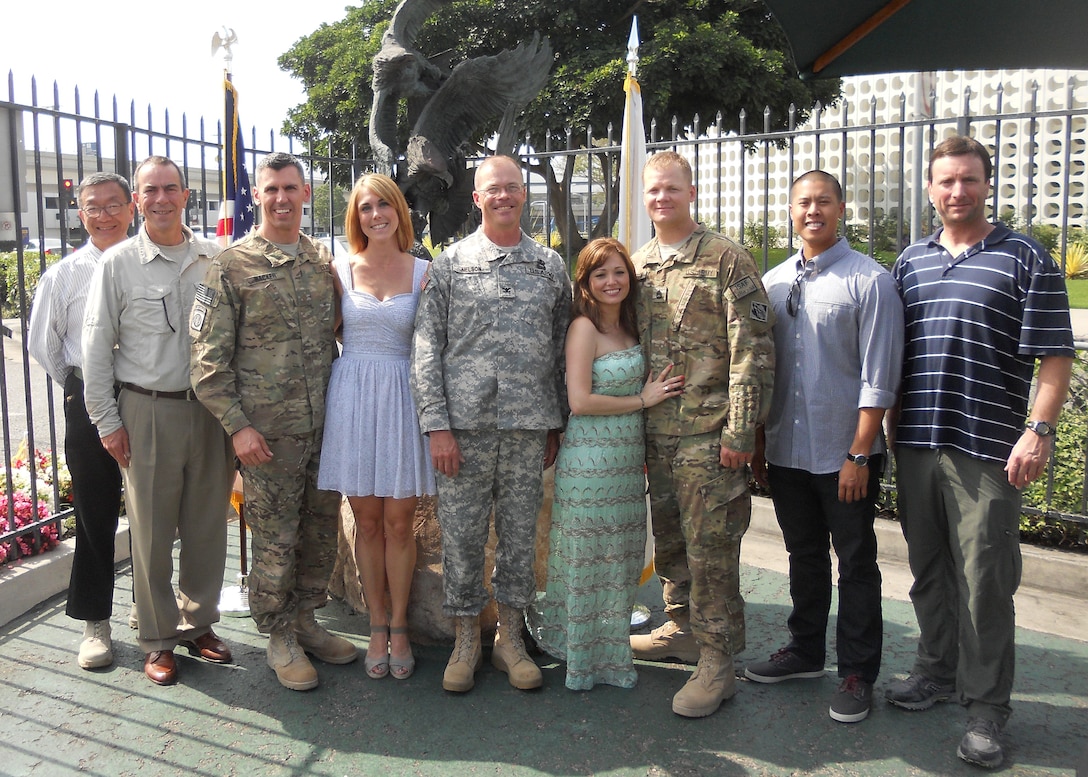 Col. Andrew Nelson (center), U.S. Army Corps of Engineers, South Pacific Division deputy commander welcomes home the Forward Engineering Support Team (FEST-A) along with family members at Los Angeles Airport on July 4, 2013 after deployment to the U.S. Army Garrision -  Bagram, Afghanistan.  Team members include (left to right) Bill Yang, Scott Gebhardt, Maj. Seth Wacker, SFC Steven Martin, Marvin Mai and Ron Riach. (U.S. Army photo by Sandra Eudy/Released)