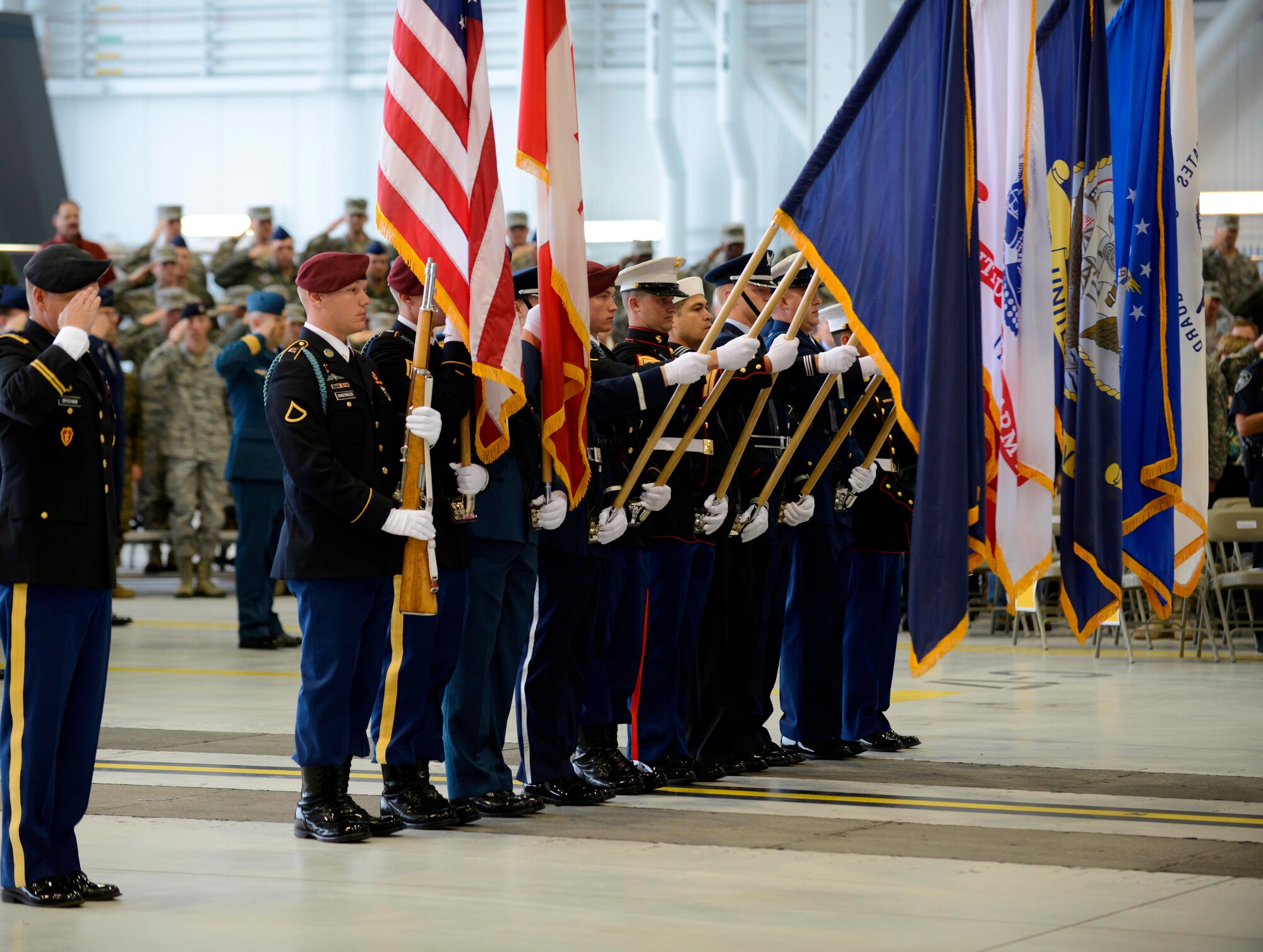 The Joint Base Elmendorf -Richardson Honor Guard presents the colors at the Alaskan Command/11th Air Force change of command ceremony Aug. 9 here.  Air Force Lt. Gen. Russell J. Handy took command from Air Force Lt. Gen. Stephen Hoog.  ALCOM is a subunified command of U.S. Pacific Command responsible for maximizing readiness for Alaskan service members and rapid global deployments. (U.S. Air Force photo/Tech Sgt. Raymond Mills)