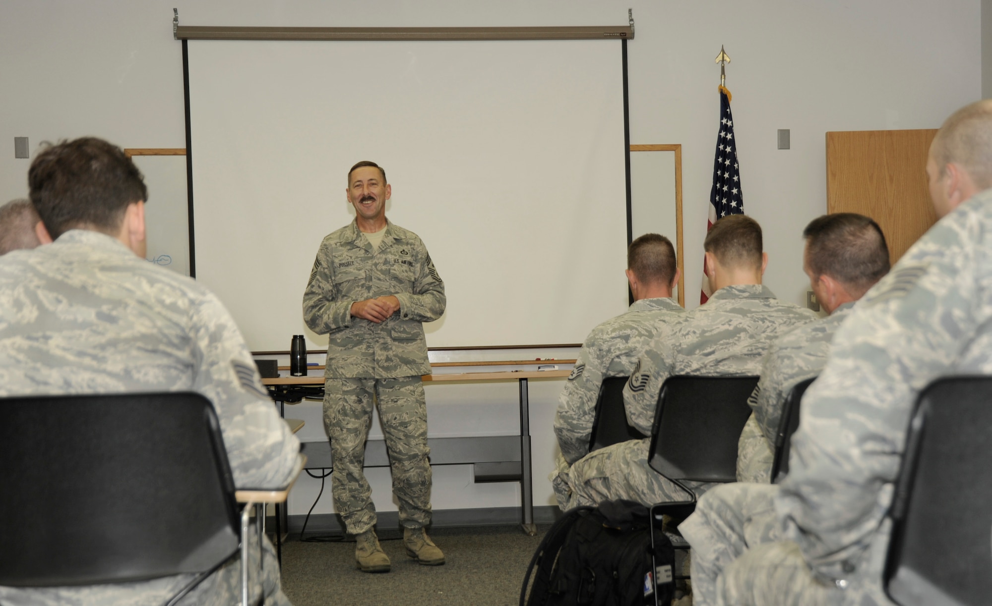 Oregon Command Chief Master Sgt. Mark Russell speaks to the Airmen of the 142nd Fighter Wing Security Forces during their in processing actions at the Portland Air National Guard Base, Ore., Aug. 9, 2013.  A total of 26 Airmen from the 142nd Fighter Wing spent six months in Qatar in support of Operation Enduring Freedom. (Air National Guard photo by Tech. Sgt. John Hughel, 142nd Fighter Wing Public Affairs/released)