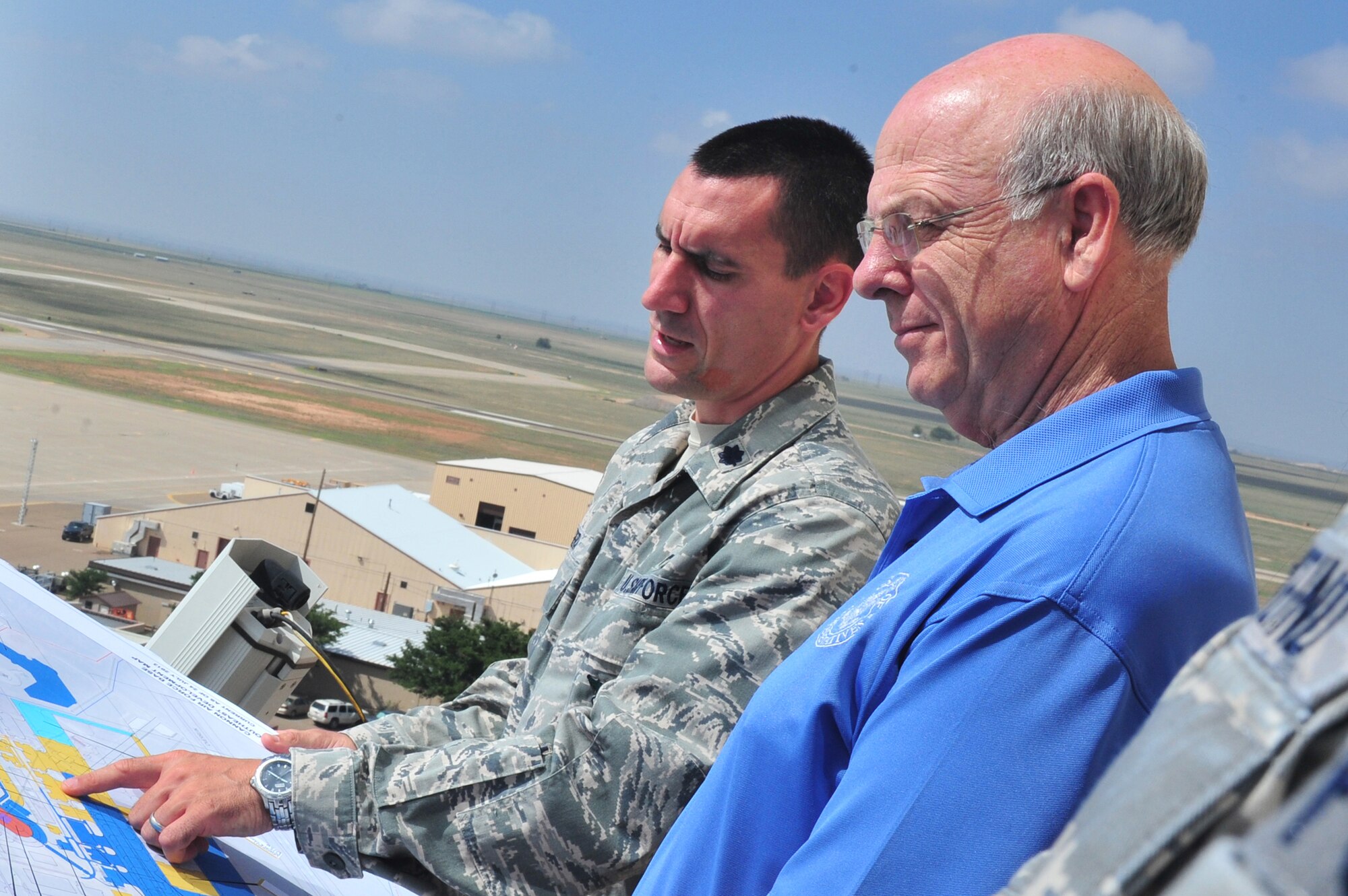 U.S. Congressman Steve Pearce, 2nd district representative of New Mexico, meets with U.S. Air Force Lt. Col. Anthony Figiera, 27th Special Operations Civil Engineer Squadron commander, during his visit Aug. 8, 2013 at Cannon Air Force Base, N.M. The purpose of his visit was to receive a comprehensive understanding of 27 SOW operations. (U.S. Air Force Photo/Airman 1st Class Xavier Lockley)