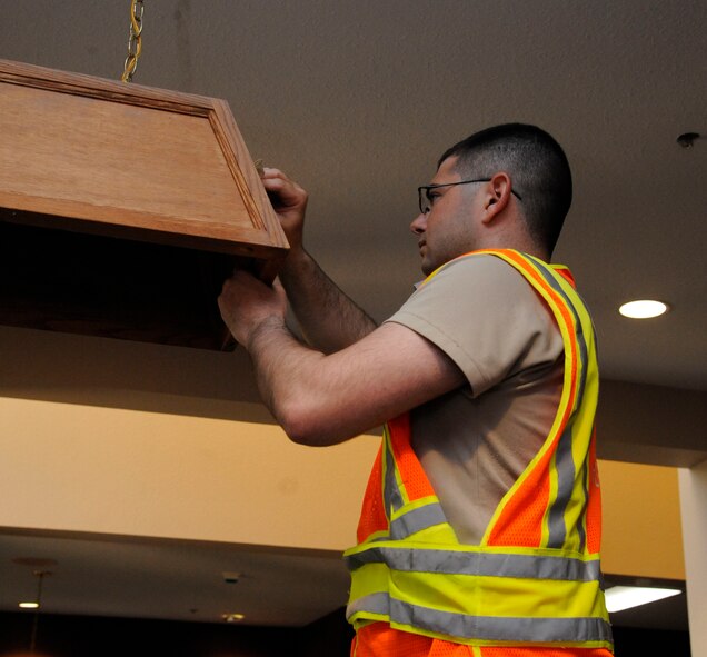 Airman John Brooks II, 2nd Security Force Squadron patrolman, cleans a dayroom during bay orderly duty on Barksdale Air Force Base, La., Aug. 9, 2013. During bay orderly duty, Airmen inspect the dormitories for any damage and perform perimeter sweeps for trash. (U.S. Air Force photo/Airman 1st Class Andrew Moua)