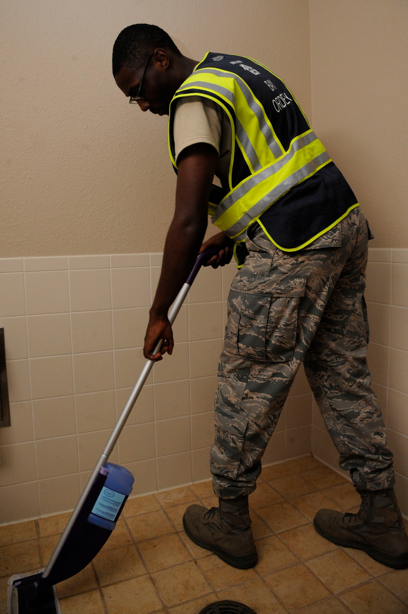 Airman 1st Class Sydney Carpenter, 307th Maintenance Squadron crew chief, cleans during bay orderly duty on Barksdale Air Force Base, La., Aug. 9, 2013. Airmen who reside in the dormitories are scheduled for the one-week bay orderly duty to help maintain the dormitory facilties. (U.S. Air Force photo/Airman 1st Class Andrew Moua)