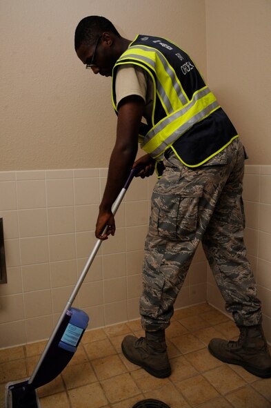 Airman 1st Class Sydney Carpenter, 307th Maintenance Squadron crew chief, cleans during bay orderly duty on Barksdale Air Force Base, La., Aug. 9, 2013. Airmen who reside in the dormitories are scheduled for the one-week bay orderly duty to help maintain the dormitory facilties. (U.S. Air Force photo/Airman 1st Class Andrew Moua)