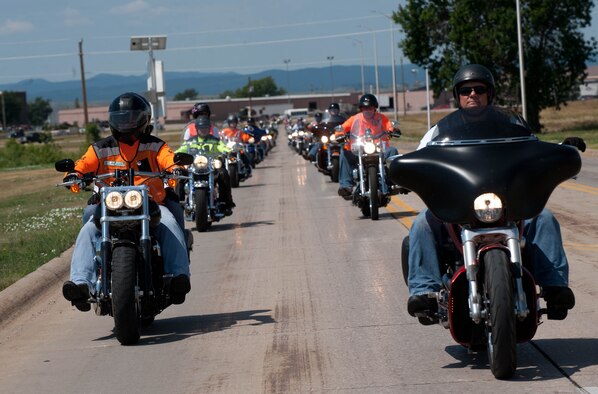 Senior Master Sgt. Danny Walker, 28th Logistics Readiness Squadron superintendent and president of the Green Knights Dakota Thunder Motorcycle Club, leads motorcyclists during the 2013 Dakota Thunder Run at Ellsworth Air Force Base, S.D., Aug. 6, 2013. The run was hosted by Ellsworth’s own GKDTMC and drew a crowd of more than 200 active-duty servicemembers, veterans, Ellsworth civilian employees and their families. (U.S. Air Force photo by Airman 1st Class Zachary Hada/Released)
