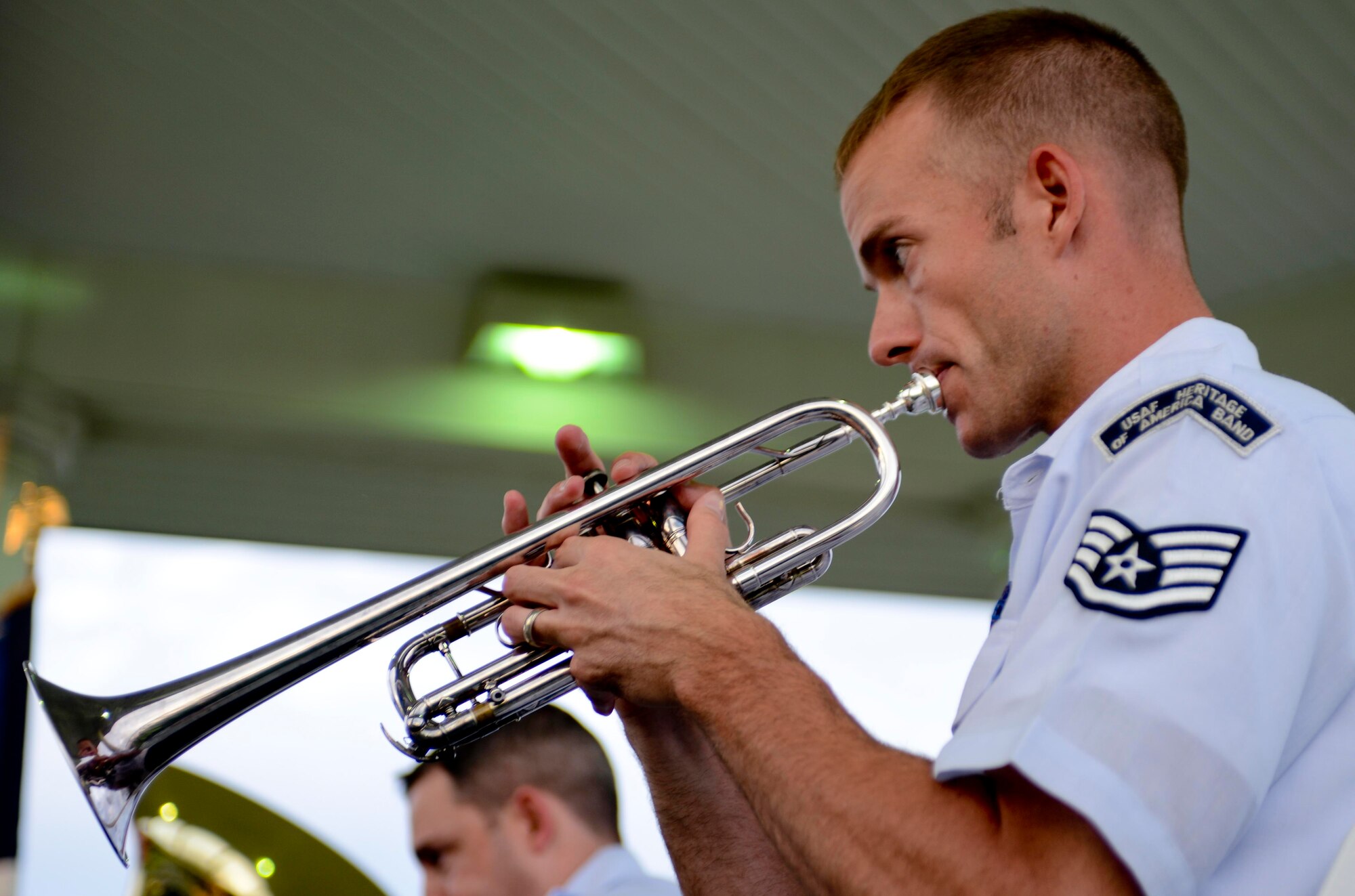 U.S. Air Force Staff Sgt. James Lantz, U.S. Air Force Heritage of America Band member, plays the trumpet during the Heritage Brass Quintet’s “Tribute to the Silver Screen” at the Music by the Bay summer concert series at Continental Park at Fort Monroe, Va., Aug. 8, 2013. The band was one of the original U.S. Army Air Corps bands, created by order of the Secretary of War on Oct. 1, 1941. (U.S. Air Force photo by Airman 1st Class R. Alex Durbin/Released)