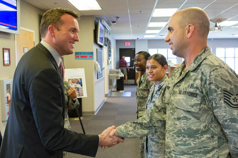Acting Secretary of the Air Force Eric Fanning meets with pharmacy staff members (right to left) Tech. Sgt. Jason Borondy, non-commissioned officer in charge of the Satellite Pharmacy Element, Capt. Jessica Pabon, officer in charge of the Satellite Pharmacy Element, and SSgt Tanisha Cathren, pharmacy technician, during his visit of the Patrick Air Force Base Satellite Pharmacy Aug. 8.
