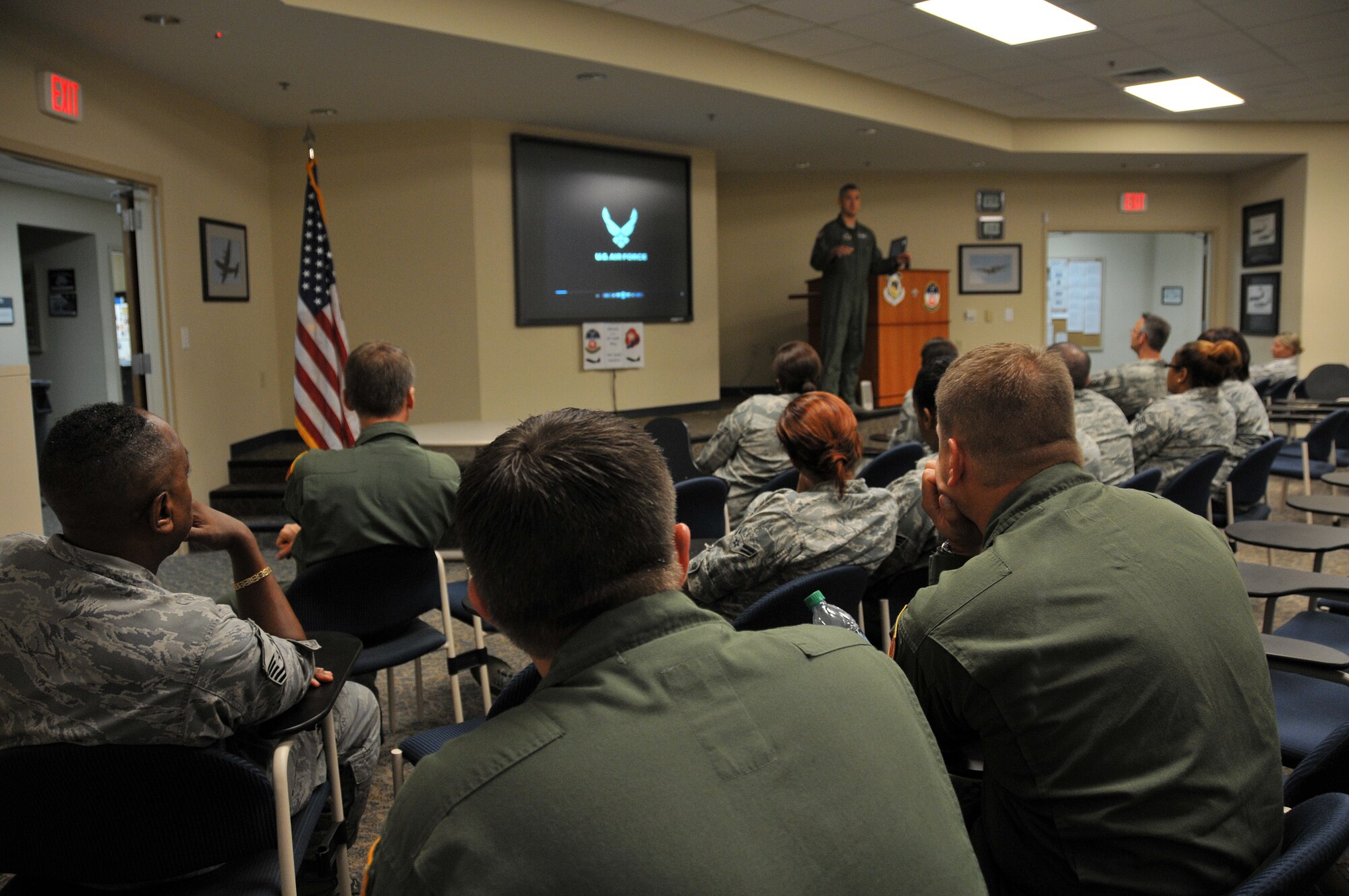 Lt. Col. Mark Cumbee, 700th Airlift Squadron commander, addresses members of the squadron, Aug. 4, relaying his zero-tolerance policy on sexual assault within the flying squadron. This commander's call was part of a SAPR stand-down following direction from the secretary of defense to conduct training for personnel before Aug. 31.  (U.S. Air Force photo/Senior Airman Elizabeth Van Patten)