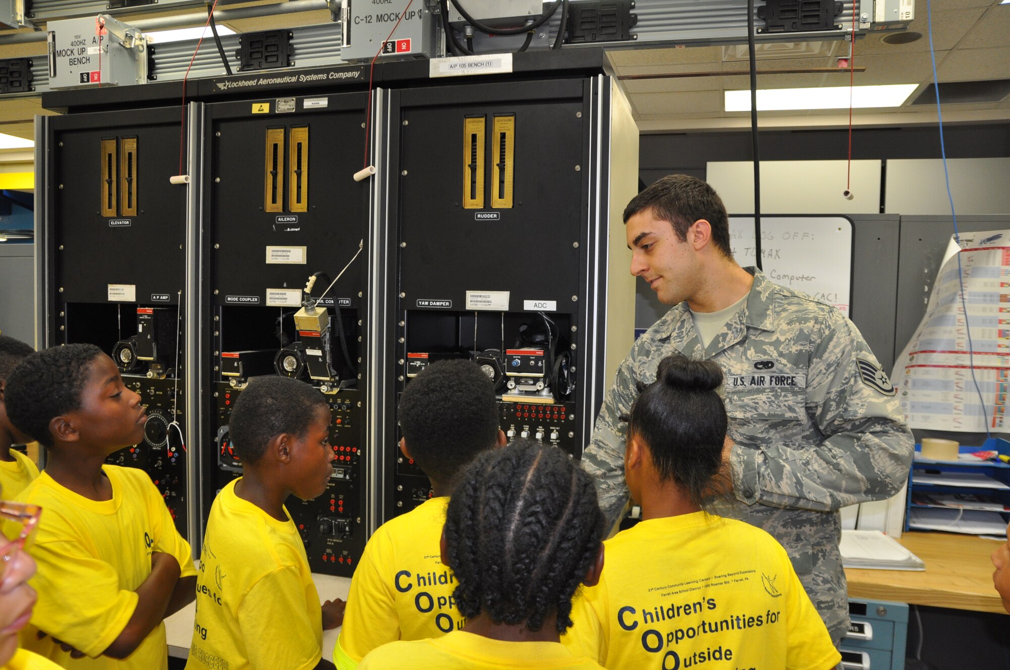 YOUNGSTOWN AIR RESERVE STATION, Ohio – Air Force Reserve Staff Sgt. Nick Pinter, a guidance control technician assigned to the Avionics shop of the 910th Maintenance Squadron, talks about an equipment rack during a tour by the Children’s Opportunities for Outside Learning program from Farrell, Pa. here, July 19, 2013. YARS accepts reservations for groups of 20-40 people for tours of the installation on selected Fridays during the tour season. For additional information about the YARS tour program, please contact the 910th Airlift Wing Public Affairs Office at 330-609-136. U.S. Air Force photo by Master Sgt. Bob Barko Jr.