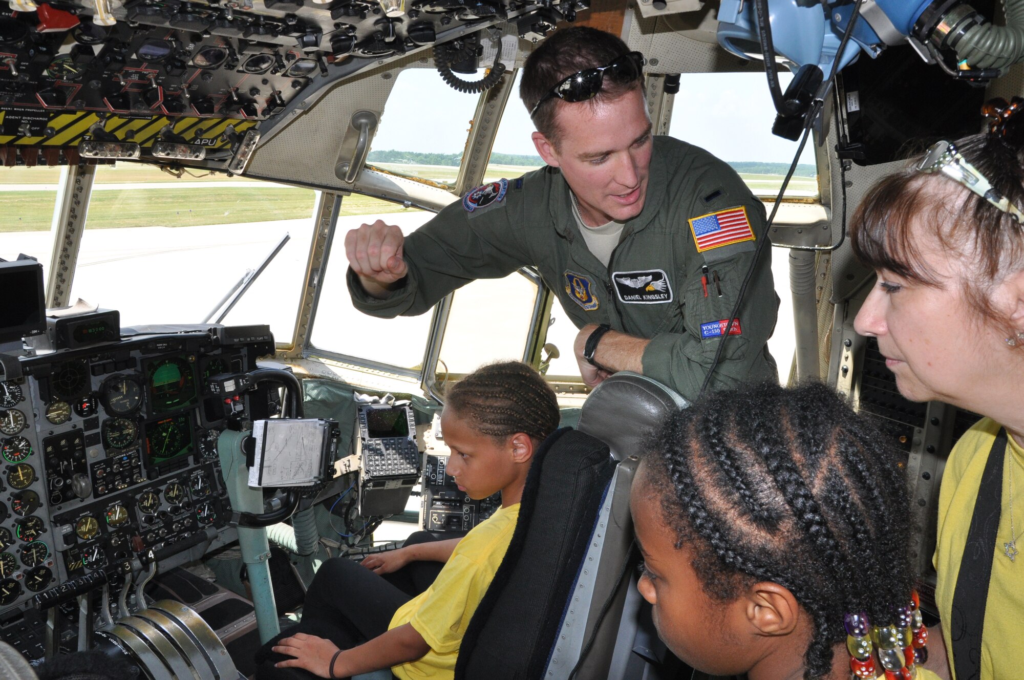 YOUNGSTOWN AIR RESERVE STATION, Ohio – Air Force Reserve 1st Lt. Daniel Kingsley, a pilot assigned to the 910th Airlift Wing’s 773rd Airlift Squadron, explains the flight controls of a C-130H Hercules tactical cargo aircraft during a tour by the Children’s Opportunities for Outside Learning program from Farrell, Pa. on the flightline here, July 19, 2013. YARS accepts reservations for groups of 20-40 people for tours of the installation on selected Fridays during the tour season. For additional information about the YARS tour program, please contact the 910th Airlift Wing Public Affairs Office at 330-609-136. U.S. Air Force photo by Master Sgt. Bob Barko Jr.