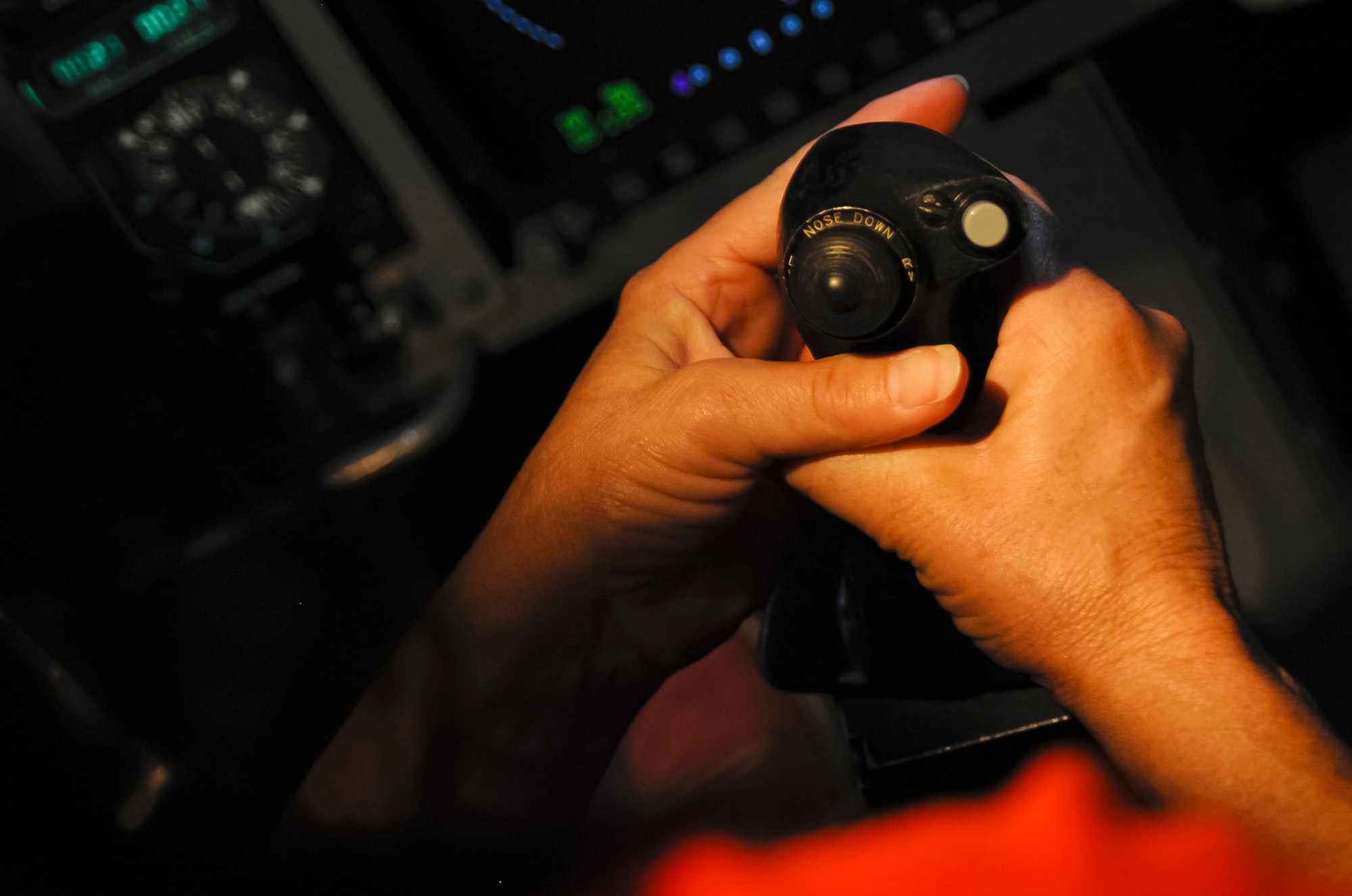 ALTUS AIR FORCE BASE, Okla. – Sue Malena, Altus High School teacher, simulates landing a U.S. Air Force C-17 Globemaster III inside a simulator as part of STEM Faculty Development Day, Aug. 8. The tour was held to give AHS teachers a chance to expecerience science, technology, engineering and math careers first hand and encourage their students to pursue careers in STEM fields. (U.S. Air Force photo by Airman 1st Class Levin Boland / Released)