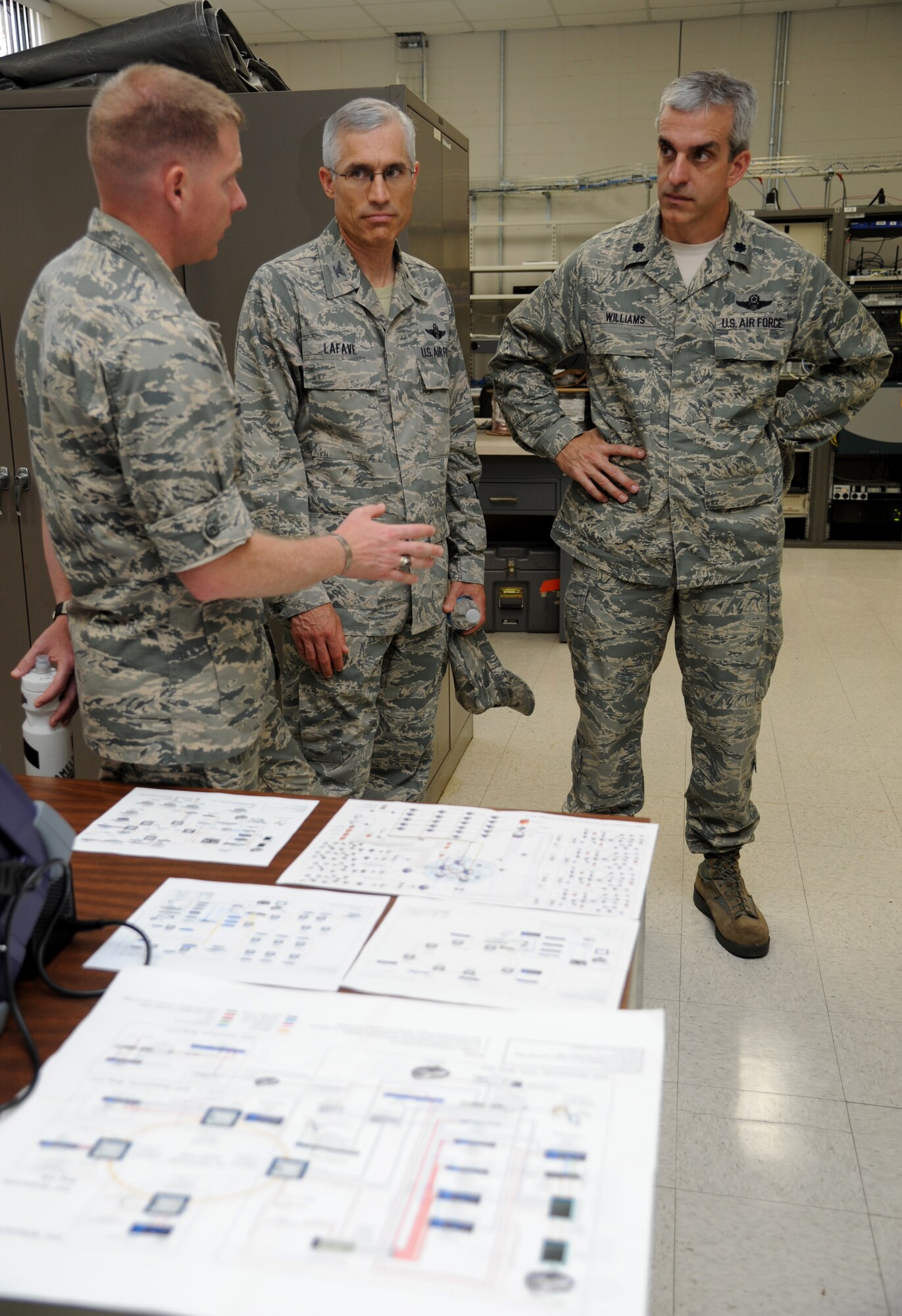 Maj. James Coughlin, 85th Engineering Installation Squadron commander, briefs Col. Craig LaFave, 403rd Wing acting wing commander, and Lt. Col. Craig Williams, 81st Training Wing safety office chief, on previously installed network diagrams during an 81st TRW leadership tour of the 85th EIS Aug. 8, 2013, at Maltby Hall, Keesler Air Force Base, Miss.  The purpose of the tour was to educate leadership on the unique services and day-to-day operations of the Air Force’s only active duty engineering installation squadron.  (U.S. Air Force photo by Kemberly Groue)