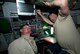 Nathan Lange, 28th Aircraft Maintenance Squadron avionics technician, and Joe Johengen, 28th AMXS electrical technician, install a new display screen in the rear cockpit of a B-1 during a temporary modification trial at Ellsworth Air Force Base, S.D., Aug. 6, 2013. The new display will increase the aircrew’s ability to quickly identify targets. (U.S. Air Force photo by Airman 1st Class Alystria Maurer/Released)