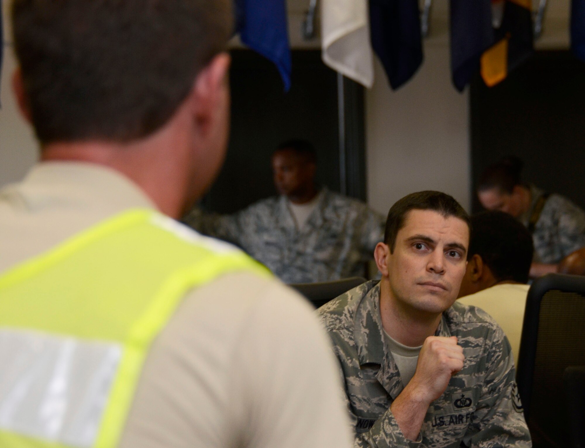 Airmen and members of the 94th Airlift Wing Development and Training Flight are separated into small groups for individual discussions during Wingman Day 2013 at the Finch Building, Dobbins Air Reserve Base, Ga. Aug. 4. Various questions were posed to the groups, including, “If you did not need the money, what would you do for work?” Airmen took a pause from day-to-day mission duties and focused on unit wellness and getting to know each other a little better. (U.S. Air Force photo/Don Peek)