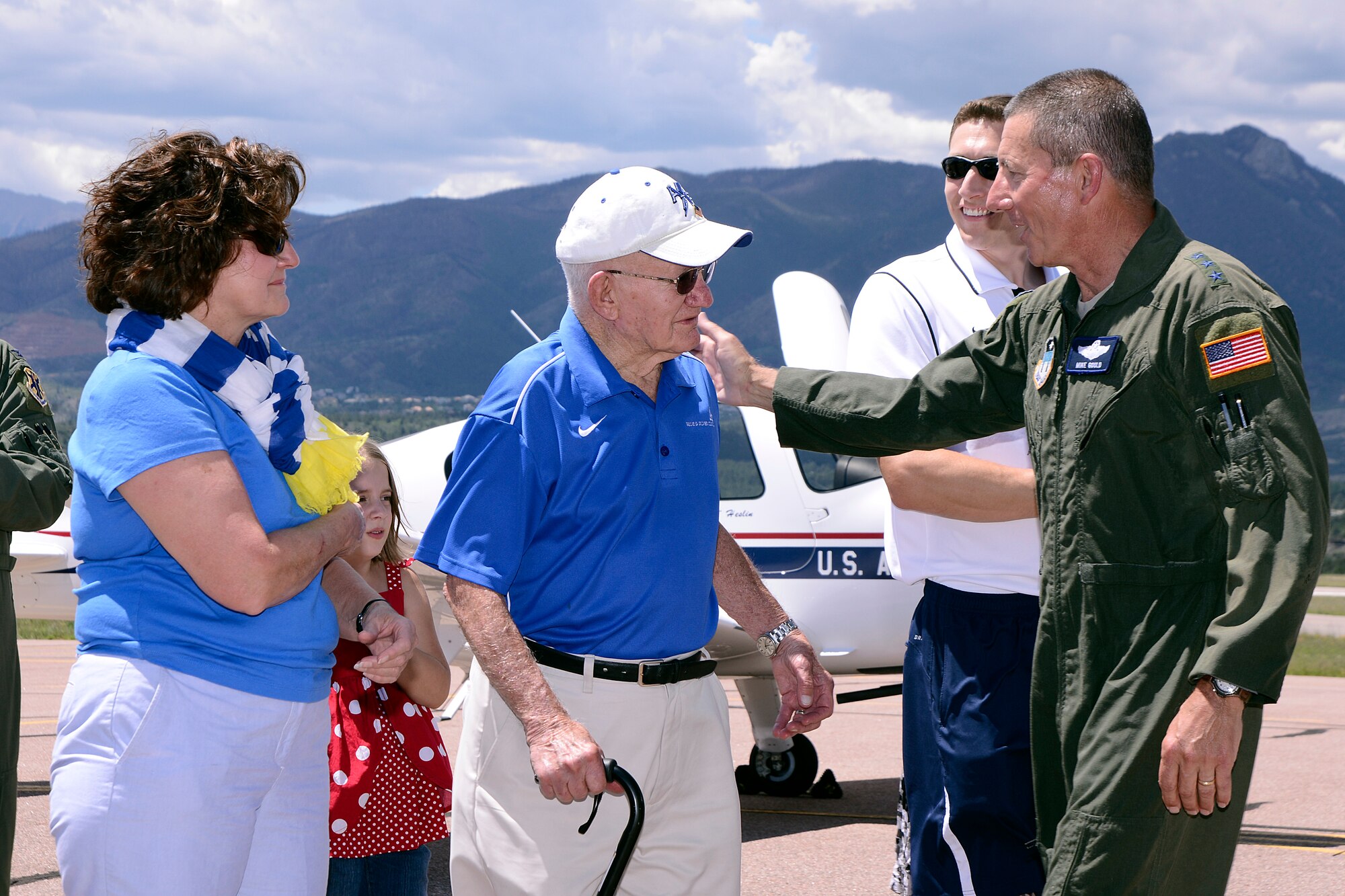 Lt. Gen. Mike Gould greets his father, Carl Gould, a World War II pilot and retired Air Force officer, and his sister Patty Gould after completing his last T-53A mission Tuesday.  (U.S. Air Force Photo/Mike Kaplan)