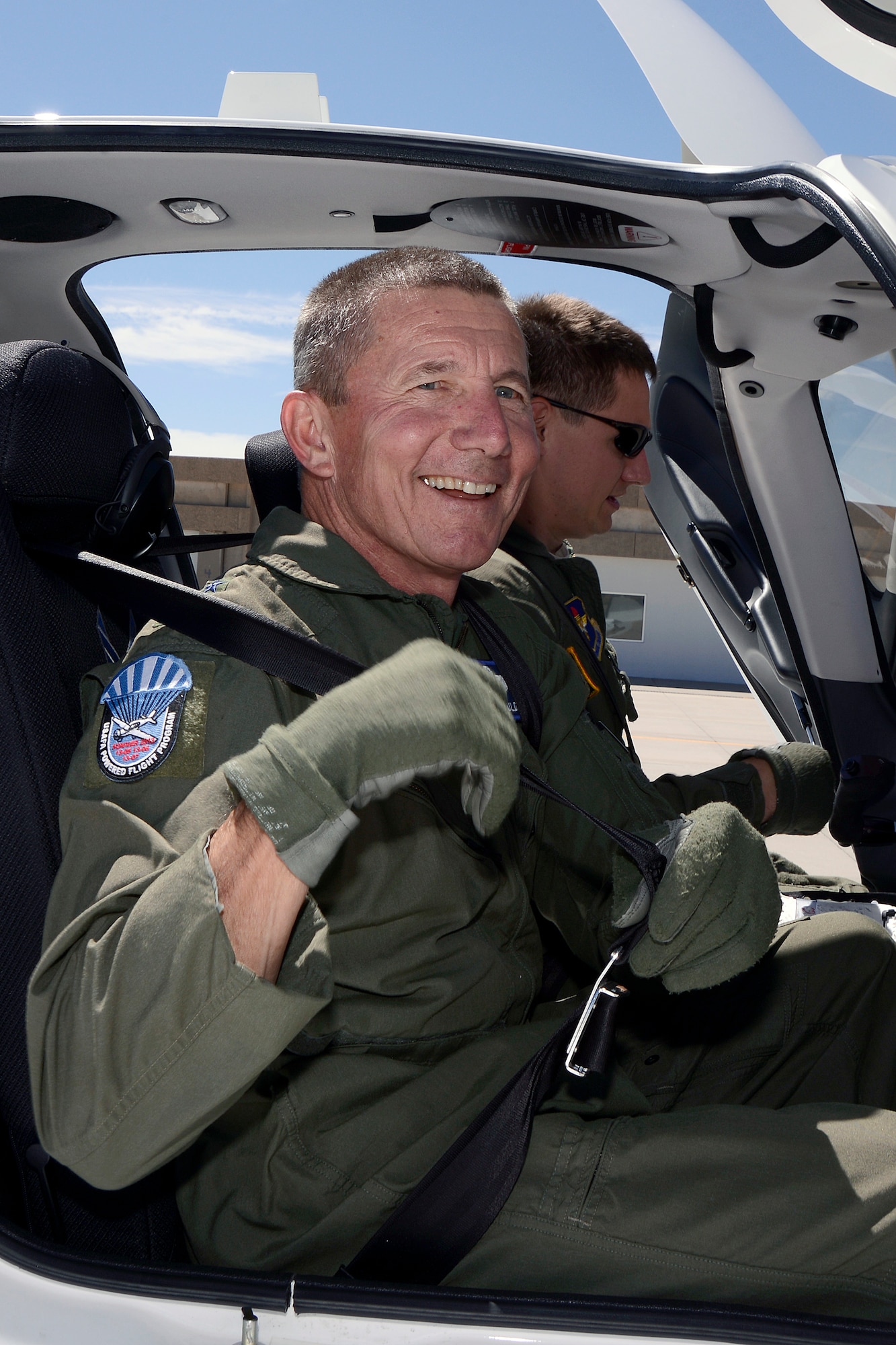 Academy Superintendent Lt. Gen. Mike Gould (front) and his son Capt. Brandon Gould, a flight instructor with the 557th Flying Training Squadron, prepare fro the general's final flight in a T-53A aircraft Tuesday at the Academy Airfield. (U.S. Air Force Photo/Mike Kaplan)