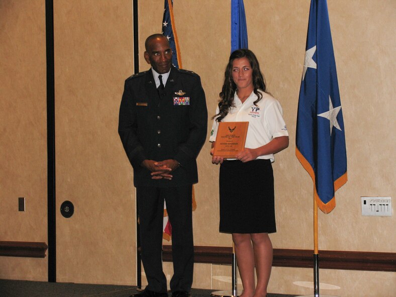 Hunter Henderson (right), daughter of U.S. Air Force Tech. Sgt. Lynn Henderson, is presented the National Guard Youth of the Year award 2013 at an award ceremony in San Antonio July 18, 2013. (Courtesy photo)