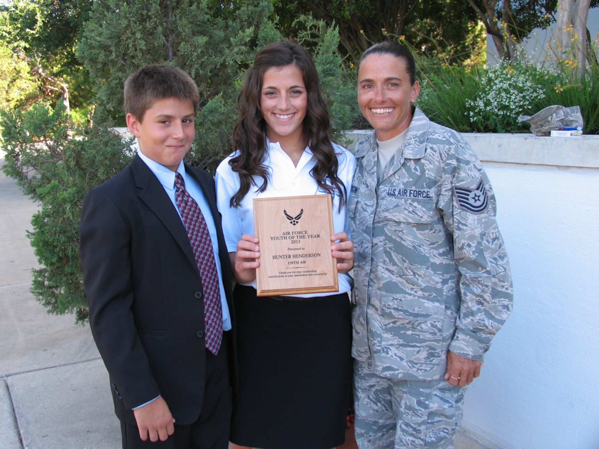 U.S. Air Force Tech. Sgt. Lynn Henderson (right), the services manager of the 139th Services Flight, Missouri Air National Guard, poses with her daughter, Hunter Henderson, at an award ceremony in San Antonio July 18, 2013. Hunter was awarded the National Guard Youth of the Year award for 2013 for her extraordinary contributions as a volunteer at Rosecrans Air National Guard Base. (Courtesy photo)