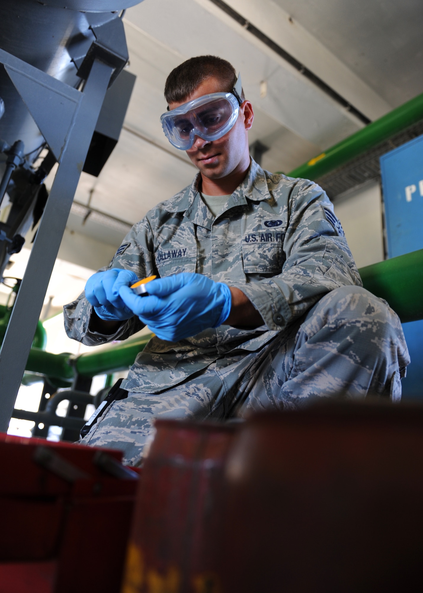 Senior Airman Harold Callaway, 39th Logistics Readiness Squadron fuels laboratory technician, handles an aeronautical engine laboratory free water detector used to test fuel quality Aug. 6, 2013, at Incirlik Air Base, Turkey. The Logistics Compliance Assessment Program will test Airmen of the 39th LRS and 39th Maintenance Squadron on their ability to comply with Air Force standards. (U.S. Air Force photo by Senior Airman Chase Hedrick/Released)