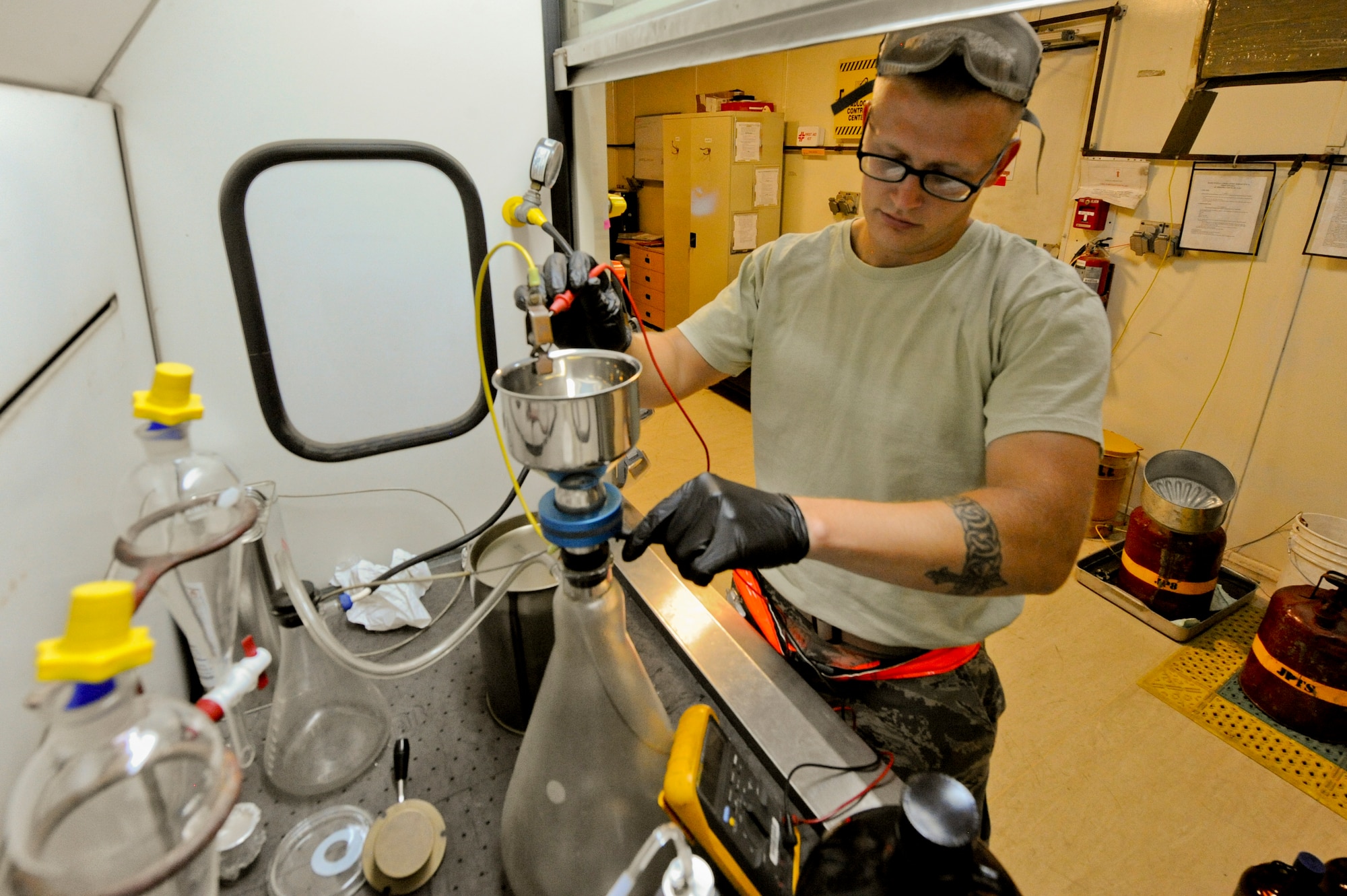 U.S. Air Force Airman 1st Class Vincent Goodwin, 380th Expeditionary Logistic Readiness Squadron fuels technician, performs an ohms test at an undisclosed location in Southwest Asia Aug. 8, 2013. The ohms are tested to ensure there is no static charge on the equipment. Goodwin is native to Rocket, Texas and is deployed from Joint Base Elmendorf-Richardson, Alaska(U.S. Air Force photo by Staff Sgt. Joshua J. Garcia)