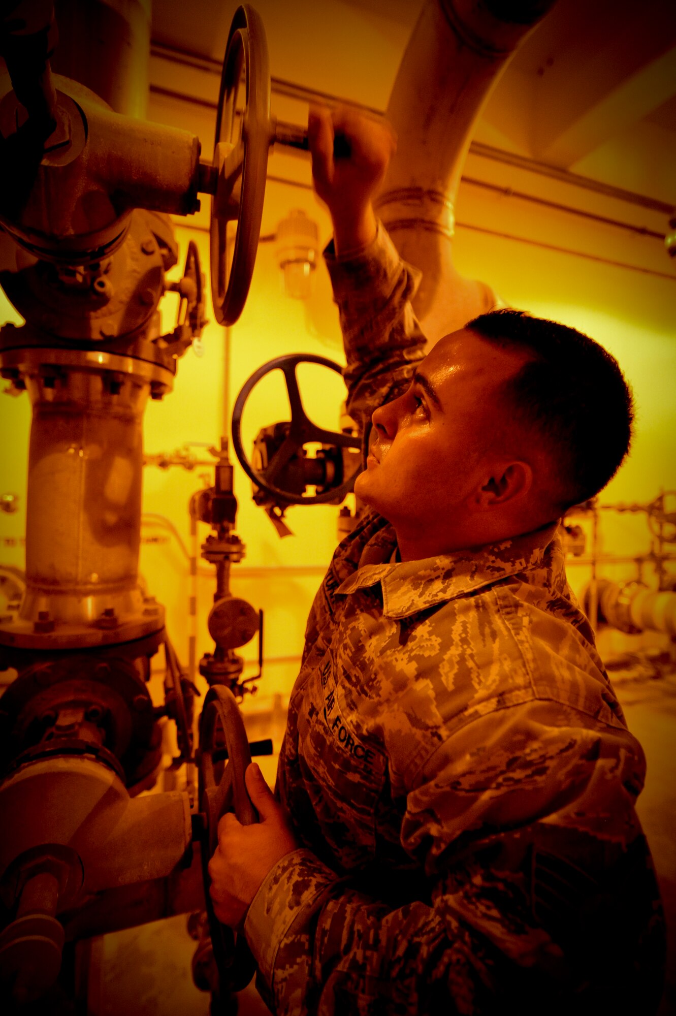 U.S. Air Force Staff Sgt. Ryan Lewis-Turk, 380th Expeditionary Logistic Readiness Squadron fuels storage supervisor, turns on a valve to select the tank that will send fuel to receiving aircraft at an undisclosed location in Southwest Asia August 7, 2013. Lewis-Turk is native to Phoenix, Ariz., and is deployed from Eielson Air Force Base, Alaska. (U.S. Air Force photo by Staff Sgt. Joshua J. Garcia)